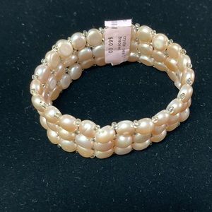 Freshwater triple strand stretch bracelet with crystal accents.  Blush